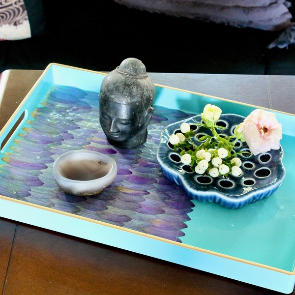 Hand decorated turquoise blue rectangular hard plastic tray with pale mauve petals with a unique design