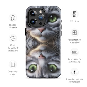 May include: A dual-layer phone case featuring a grey and white cat design. The case is impact-resistant and has open ports for connectivity. It is also compatible with wireless charging.