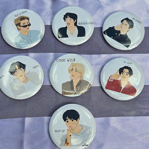 May include: Seven circular pin-back buttons featuring illustrated characters. Text includes: this is illegal, ahhhhhhhh, ice cream, swim, c'mon wing, i'm done, and shut up. Each button displays a different person in various outfits and poses.