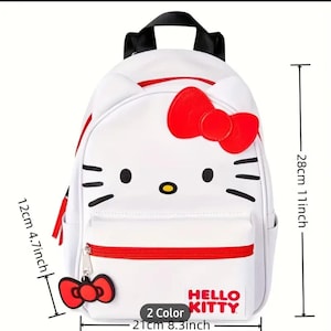 May include: White Hello Kitty backpack with red accents. The backpack features a Hello Kitty face with a red bow. The backpack measures 11 inches tall and 8.3 inches wide.