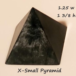 May include: A dark, X-Small pyramid with a textured surface. The pyramid is 1.25 inches wide and 1 3/8 inches high. The text "X-Small Pyramid" is at the bottom.