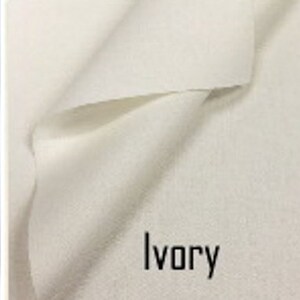 May include: Five fabric swatches in different colors: black, white, ivory, navy, and brown.