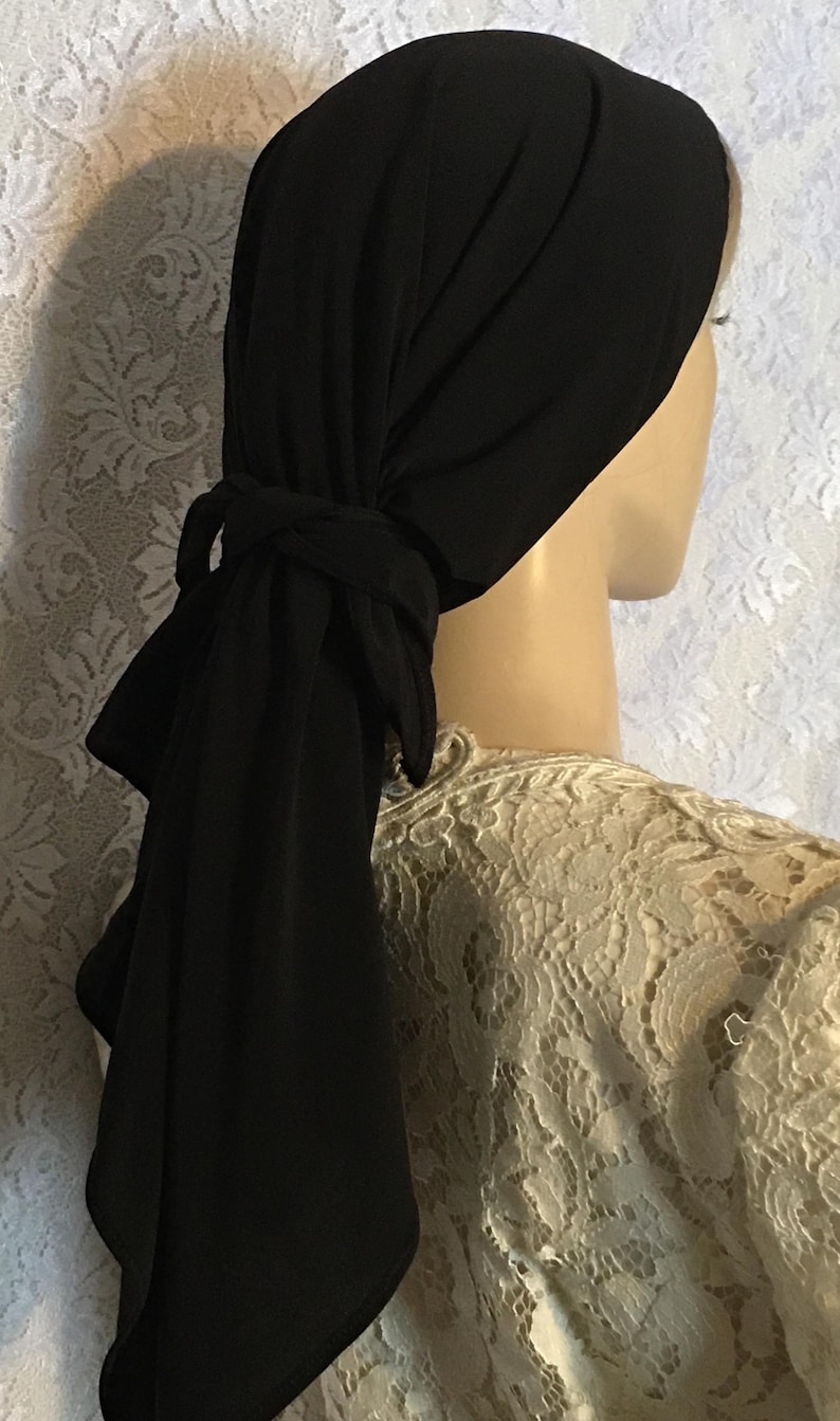 Lightweight and stylish, this black scarf serves as a versatile head covering for prayer and modest wear