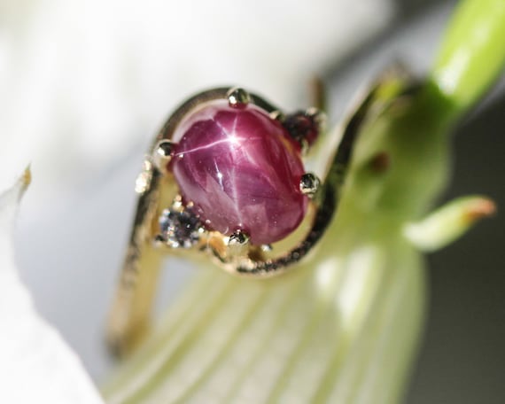 Oval Star Ruby Ring and Twin Side Set Diamonds With 14k Gold