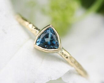 Trillion London blue topaz ring in bezel setting with 18k gold texture band