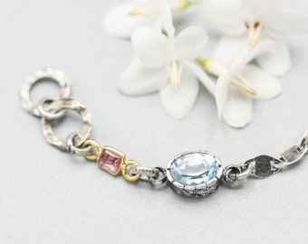 Oval Blue topaz pendant bracelet with pink sapphire gemstone on sterling silver chain