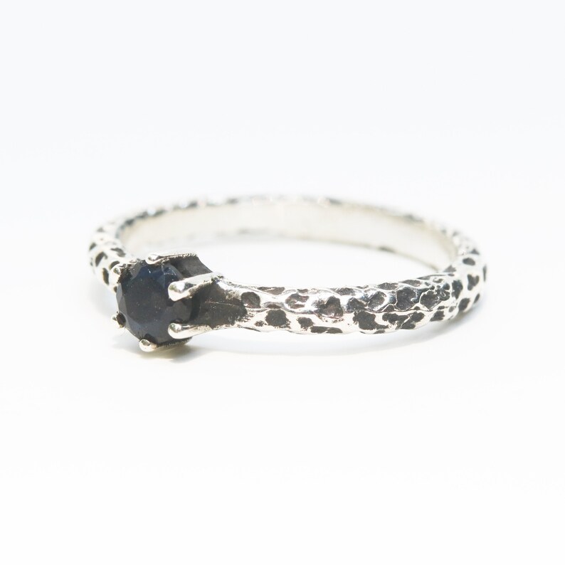 Round faceted labradorite ring in prongs setting with sterling silver oxidized texture band