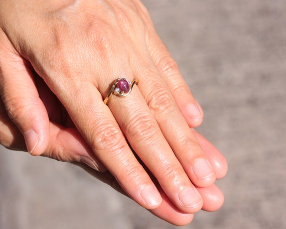 Oval Star Ruby Ring and Twin Side Set Diamonds With 14k Gold
