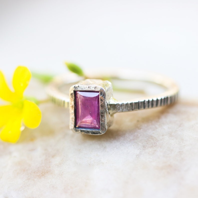 Pink sapphire in silver bezel setting with oxidized sterling silver texture design band