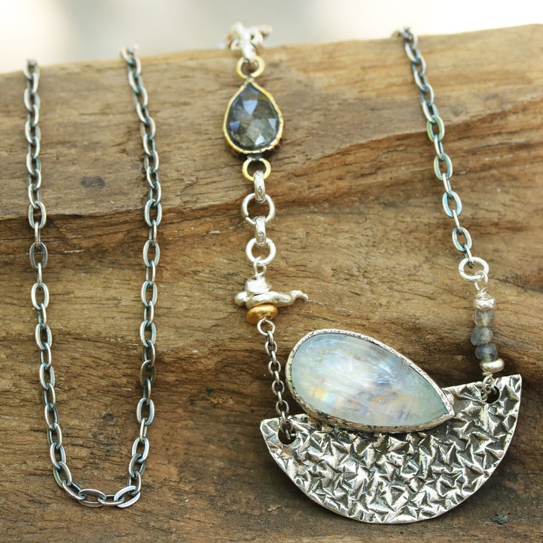 Moonstone pendant necklace in silver bezel setting and silver textured fan with black rutilated quartz on the side and oxidized silver chain