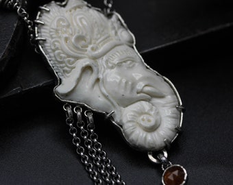 Hand Carved Bone Ganesha pendant necklace with orange kyanite and silver chain decoration