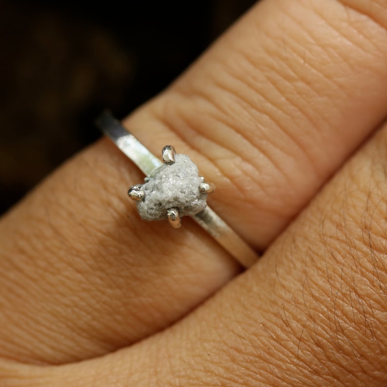 Sterling silver in high polished band ring with white grey raw rough diamond in prongs setting