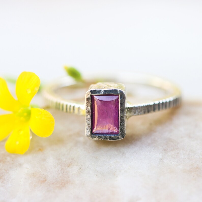 Pink sapphire in silver bezel setting with oxidized sterling silver texture design band