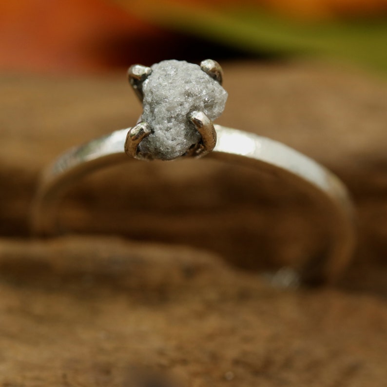 Sterling silver in high polished band ring with white grey raw rough diamond in prongs setting