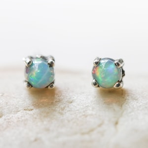 Sterling silver stud earrings with opal cabochon in prongs setting with sterling silver post and backing