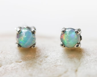 Sterling silver stud earrings with opal cabochon in prongs setting with sterling silver post and backing