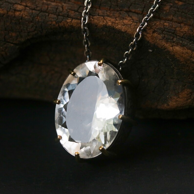 Oval faceted white topaz necklace in silver bezel and prongs setting with silver beads secondary on oxidized silver chain