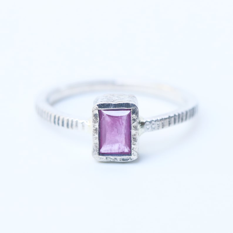 Pink sapphire in silver bezel setting with oxidized sterling silver texture design band