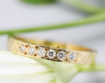 Tiny diamond eternity ring with 18k yellow gold band