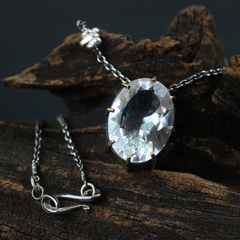 Oval faceted white topaz necklace in silver bezel and prongs setting with silver beads secondary on oxidized silver chain