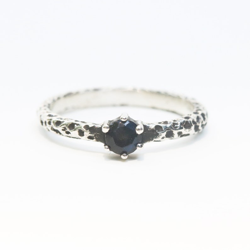 Round faceted labradorite ring in prongs setting with sterling silver oxidized texture band