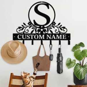 May include: A set of three ceramic mugs with a speckled, matte finish. The mugs are in shades of cream, light gray, and dark gray. Each mug has a simple, minimalist design, perfect for coffee or tea.