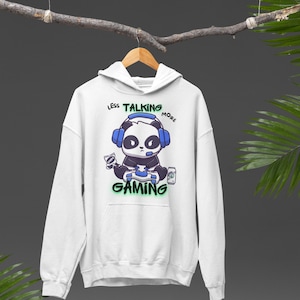 May include: White hoodie with a panda wearing headphones and holding a video game controller. The text "Less Talking More Gaming" is printed on the hoodie.