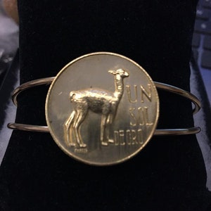 Peru coin Bangle cuff bracelet made with a genuine 1 sol de Oro coin featuring a Vicuna