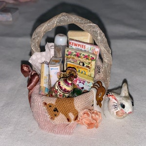 miniature baby gift basket of toys and accessories