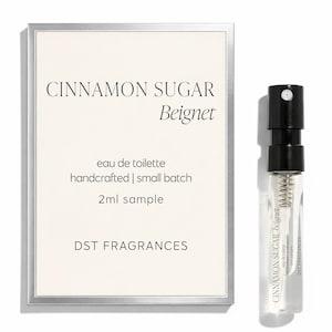 May include: A 2ml sample of Cinnamon Sugar Beignet eau de toilette by DST Fragrances. The product is presented with a rectangular card featuring the text Cinnamon Sugar Beignet, eau de toilette, handcrafted | small batch, 2ml sample, DST FRAGRANCES.