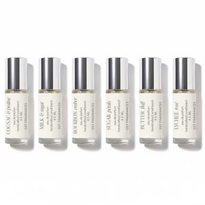 May include: Six small perfume bottles with silver caps and white labels. Each label displays a fragrance name: Cognac & Praline, Milk & Sugar, Bourbon Ember, Sugar Petals, Butter Fluff, and Lychee Rose. The bottles are labeled "eau de parfum" and "4.5 ML".