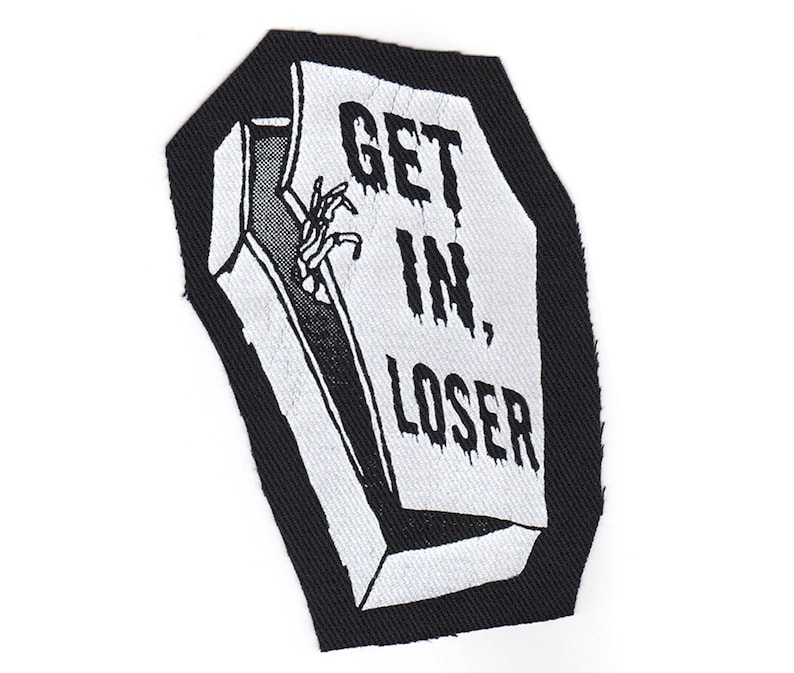 May include: Black and white embroidered patch of a coffin with the text "GET IN, LOSER" on the front.