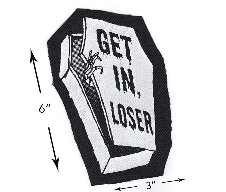 May include: Black and white embroidered patch shaped like a coffin with the text "GET IN, LOSER" on the front. The patch is 6 inches tall and 3 inches wide.
