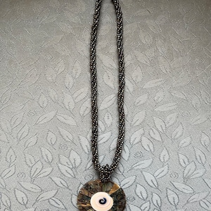 Abalone disc beaded necklace.