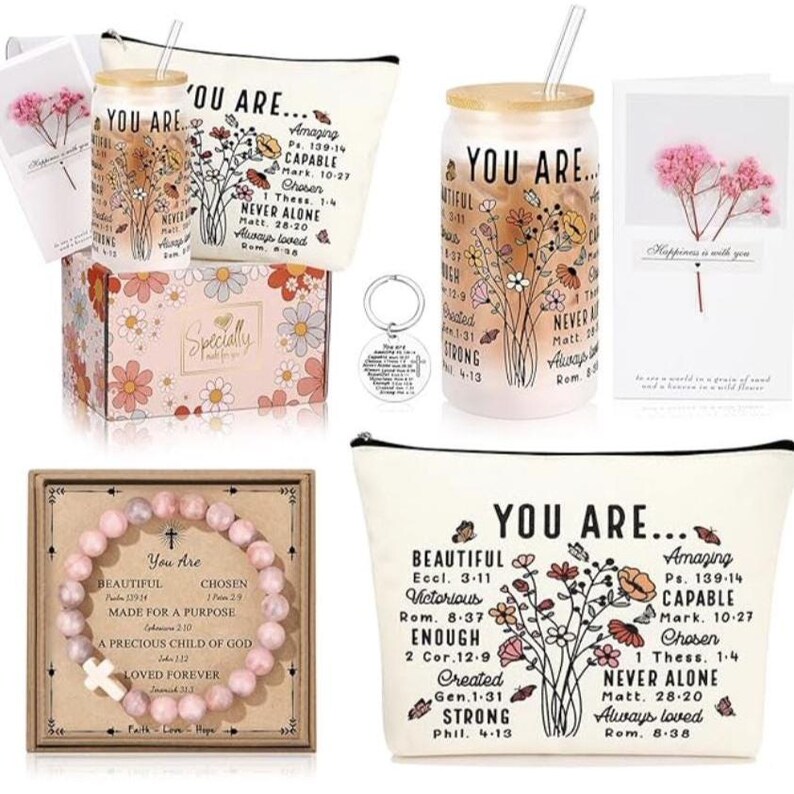 May include: A gift set with a pink and white floral theme. The set includes a pink and white floral makeup bag, a pink and white floral tumbler with a straw, a pink and white floral keychain, a pink and white floral box, and a pink and white floral bracelet. The set also includes a card with the text "Happiness is with you".