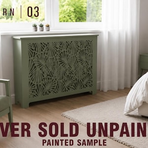 May include: A rectangular sage green radiator cover featuring a decorative laser-cut fan pattern on the front panel. The text PATTERN 03 is visible at the top left, and the text COVER SOLD UNPAINTED PAINTED SAMPLE is at the bottom.