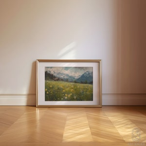 May include: A framed painting of a landscape with a mountain range in the background, a field of yellow wildflowers in the foreground, and a small house in the distance.