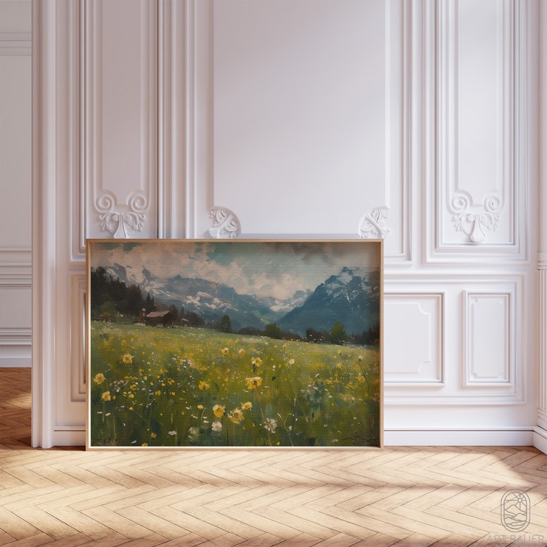 May include: A framed painting of a landscape with a small house in the distance. The painting features a field of yellow wildflowers in the foreground, with mountains and a blue sky in the background.
