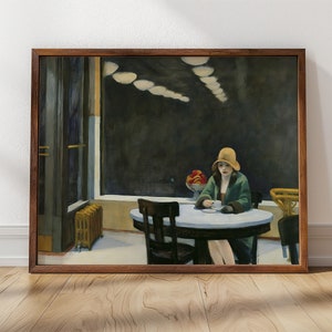 May include: A woman in a green coat and a yellow hat sits at a table in a dimly lit cafe. The table is round and has a white tablecloth. There are two chairs at the table, one of which is empty. The woman is holding a cup of coffee in her hand. There are several light fixtures hanging from the ceiling.
