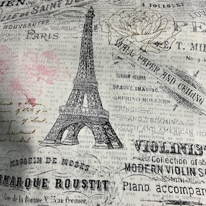 May include: A fabric with a vintage Parisian theme, featuring the Eiffel Tower, roses, and French text in black and sepia tones. The design includes words like "Paris" and "Saint Denis" on a cream background.