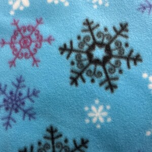 Crate Pad Snowflake Multi on Blue Fleece