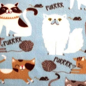 Kratmat - grote katten met garen op blauw