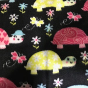 Crate Mat - Multicolor Turtles on Black - small 24 x 18