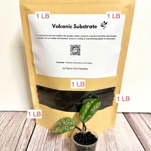 May include: A tan stand-up pouch labeled Volcanic Substrate containing 1 LB of dark granular material, featuring a white label with text, a QR code, and the brand name Plants Pots Paradise, alongside a small clear cup holding a plant in substrate.