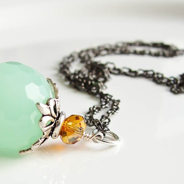 S I L E N C E. B E T W E E N..... Mint glass bead with orange crystal on gunmetal necklace