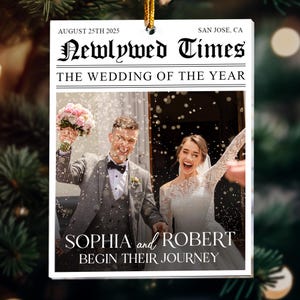 May include: A rectangular white ornament featuring a newspaper-style design titled Newlywed Times. It includes the text August 25th 2025, San Jose, CA, The Wedding of the Year, and Sophia and Robert Begin Their Journey over a photo of a couple.