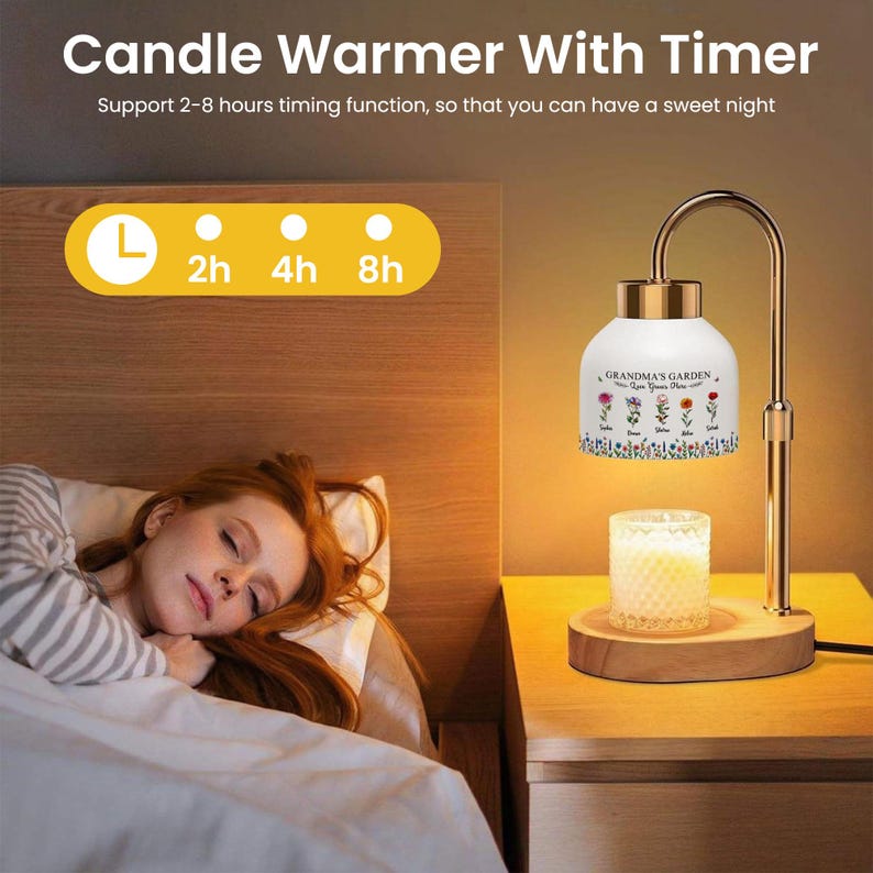 May include: A candle warmer with a timer, featuring a gold-colored metal frame and a wooden base. The white shade is decorated with floral designs and the text "GRANDMA'S GARDEN". The timer offers 2, 4, and 8-hour settings. A lit candle sits on the wooden base.