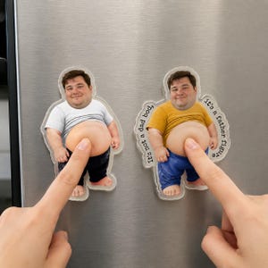 May include: Two clear acrylic magnets featuring a smiling man with a protruding belly. One wears a white shirt, the other a yellow shirt and blue jeans. Text around the second magnet reads "It's not a dad bod, it's a father figure."