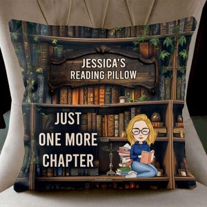 May include: A decorative pillow featuring a bookshelf design with the text "Jessica's Reading Pillow" and "Just One More Chapter." The pillow has a cartoon illustration of a person reading a book. The color palette includes browns, greens, and blues.