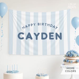 May include: Blue and white striped birthday banner with the text "Happy Birthday Cayden".